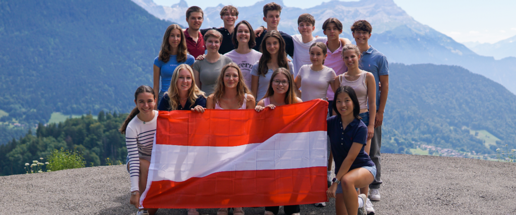 photo of Austrian students holding their flag headed for exchange year at US private high schools