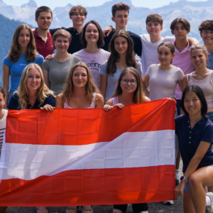 photo of Austrian students holding their flag headed for exchange year at US private high schools