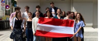 photo of Austrian students holding their flag headed for exchange year at US private high schools